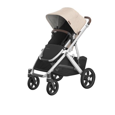 UPPAbaby Vista V3 stroller in 'Declan - Oat Melange' color, shown with a black frame, silver accents, and a beige canopy.