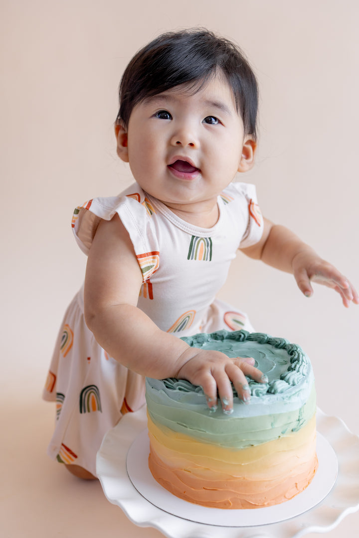 Kyte Baby Twirl Bodysuit Dress (Retro Rainbow)