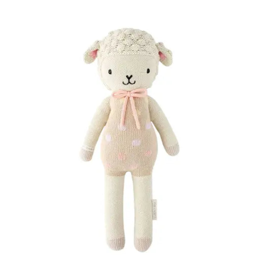 Knitted toy sheep with a pink bow on a white background