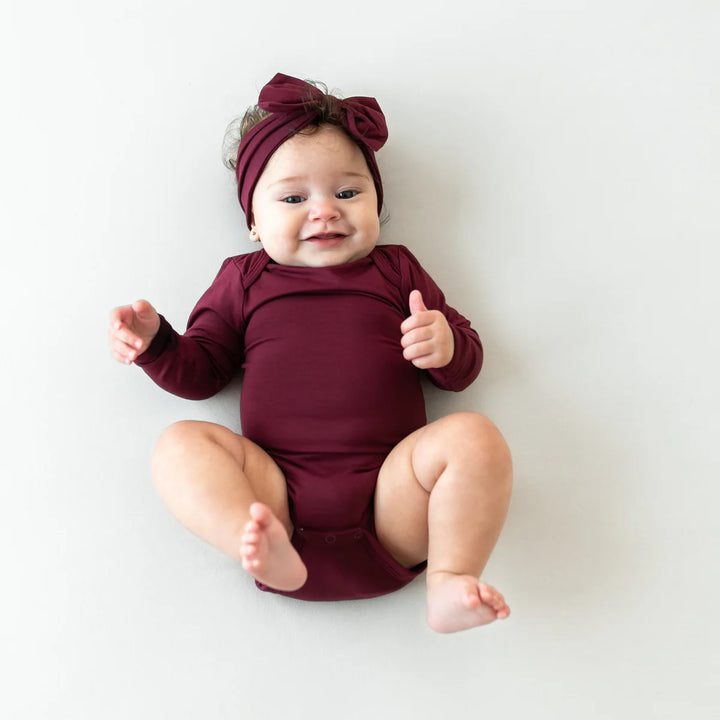 Kyte Baby Long Sleeve Bodysuit (Burgundy)