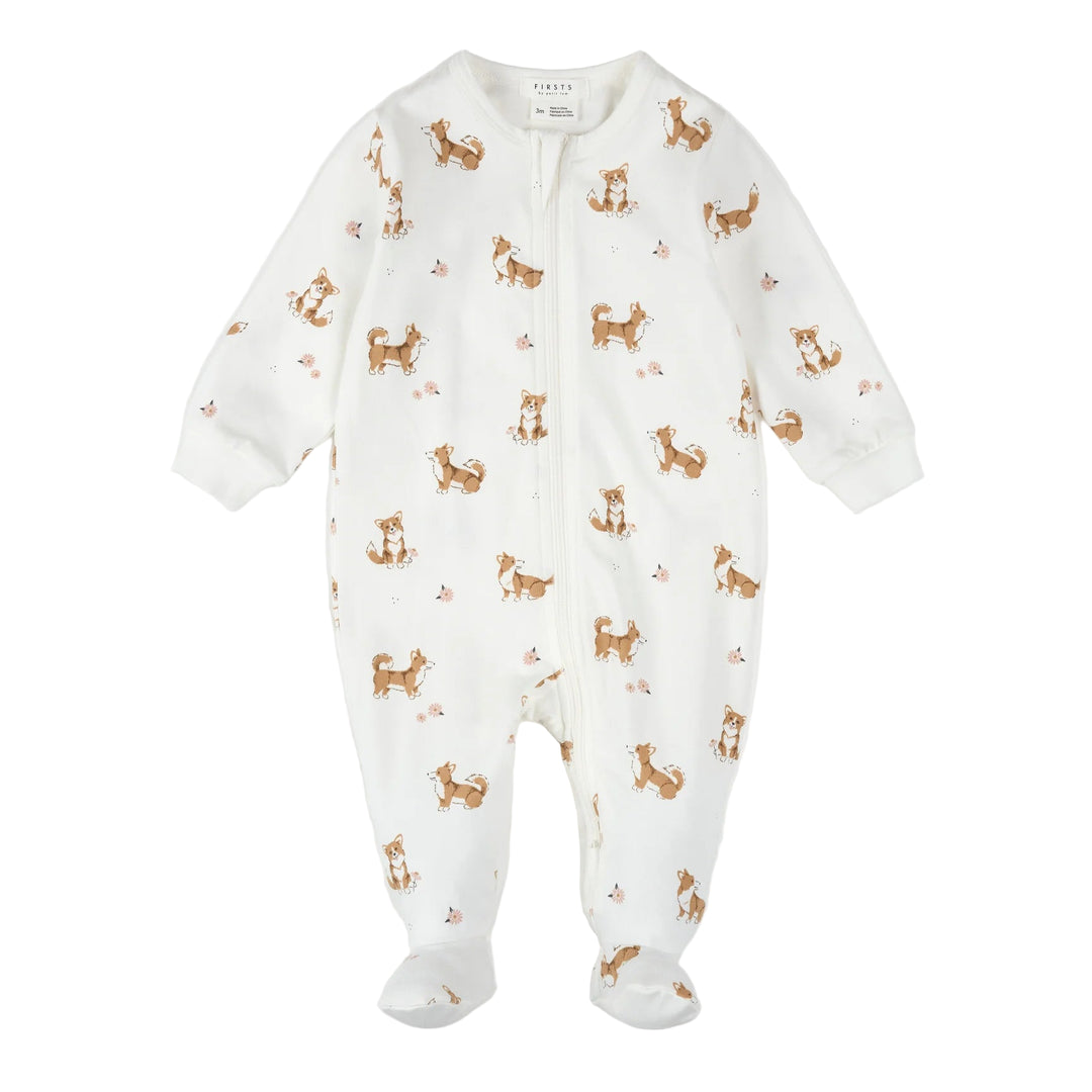 White baby onesie with brown dog pattern on a white background