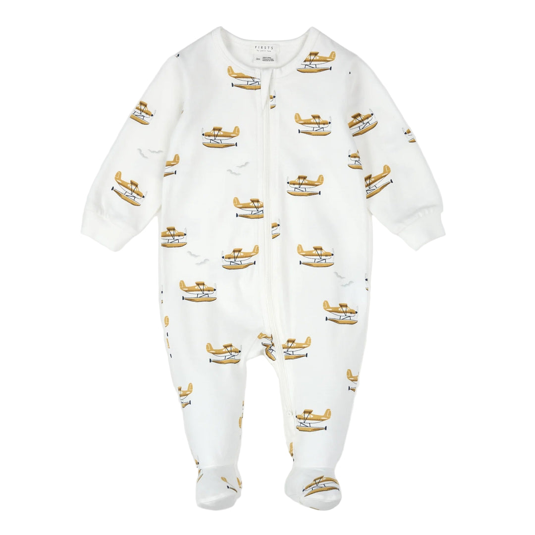 White baby onesie with airplane pattern on a white background