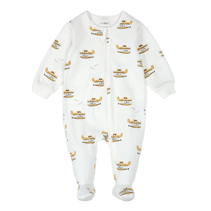 White baby onesie with airplane pattern on a white background