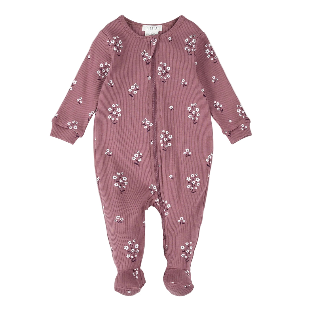 Pink baby onesie with floral pattern on a white background