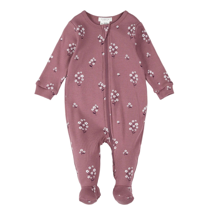 Pink baby onesie with floral pattern on a white background